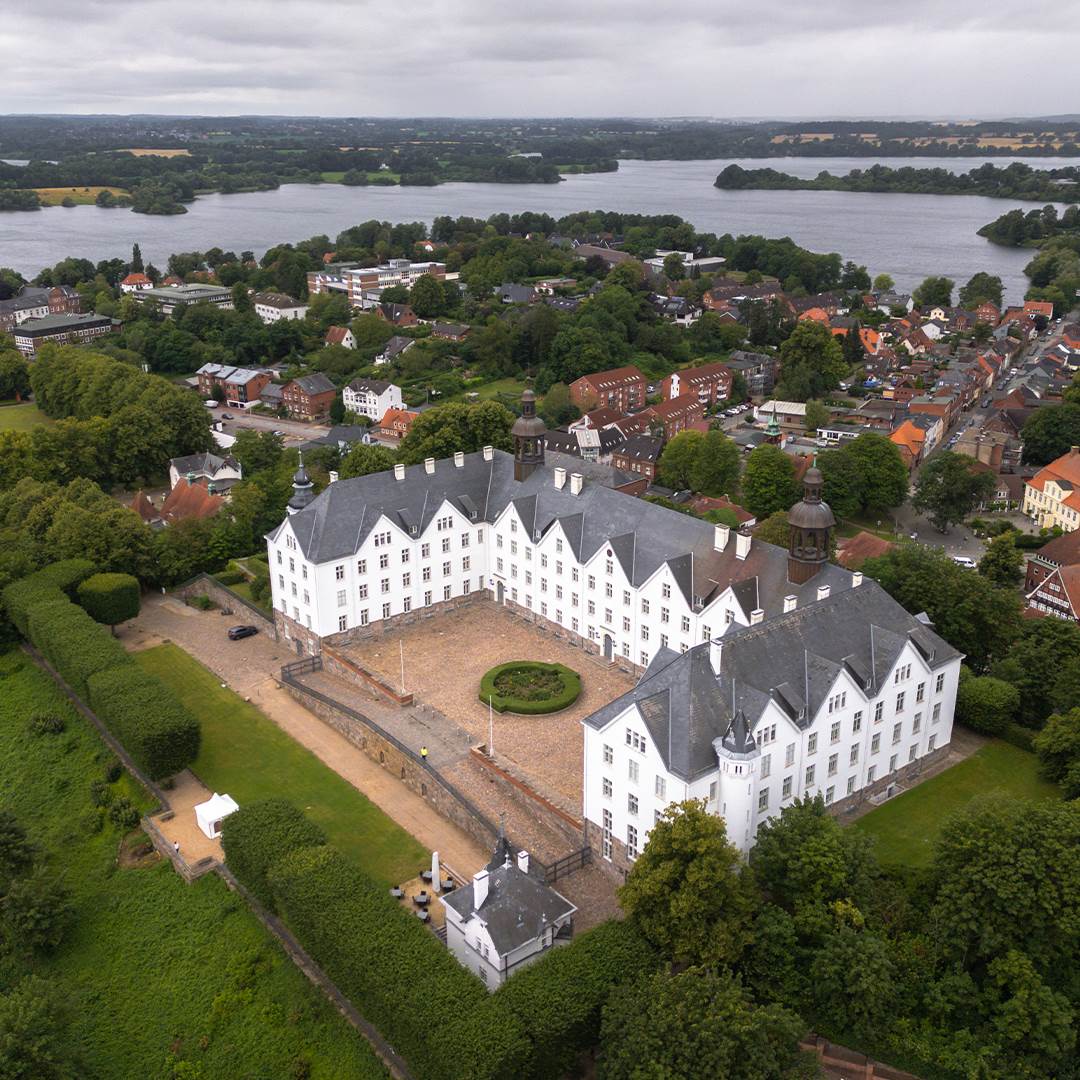 The Plöner Schloss with the surrounding city and lakes.